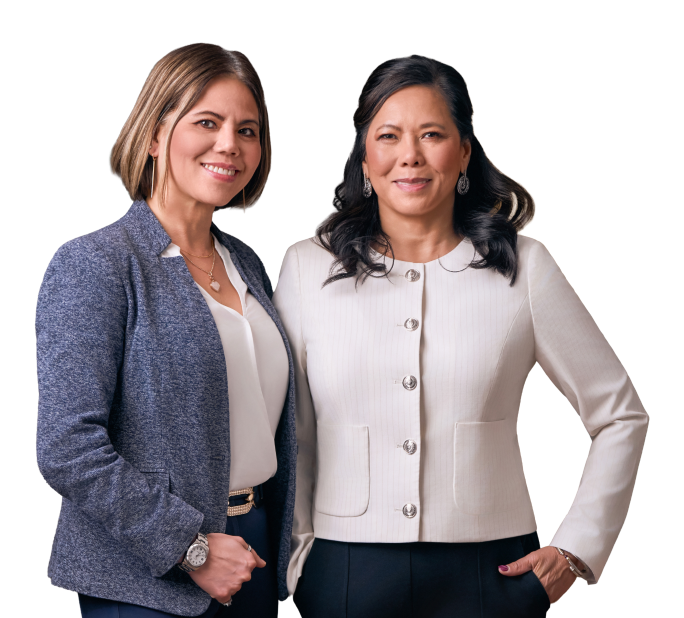 Two Syncare recruitment professionals standing together